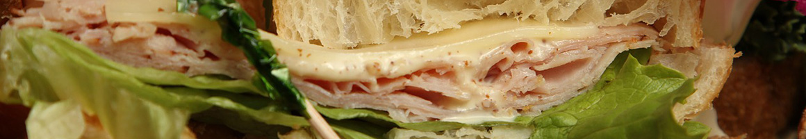 Eating Deli Sandwich at Blanchard Mercantile restaurant in Blanchard, ID.